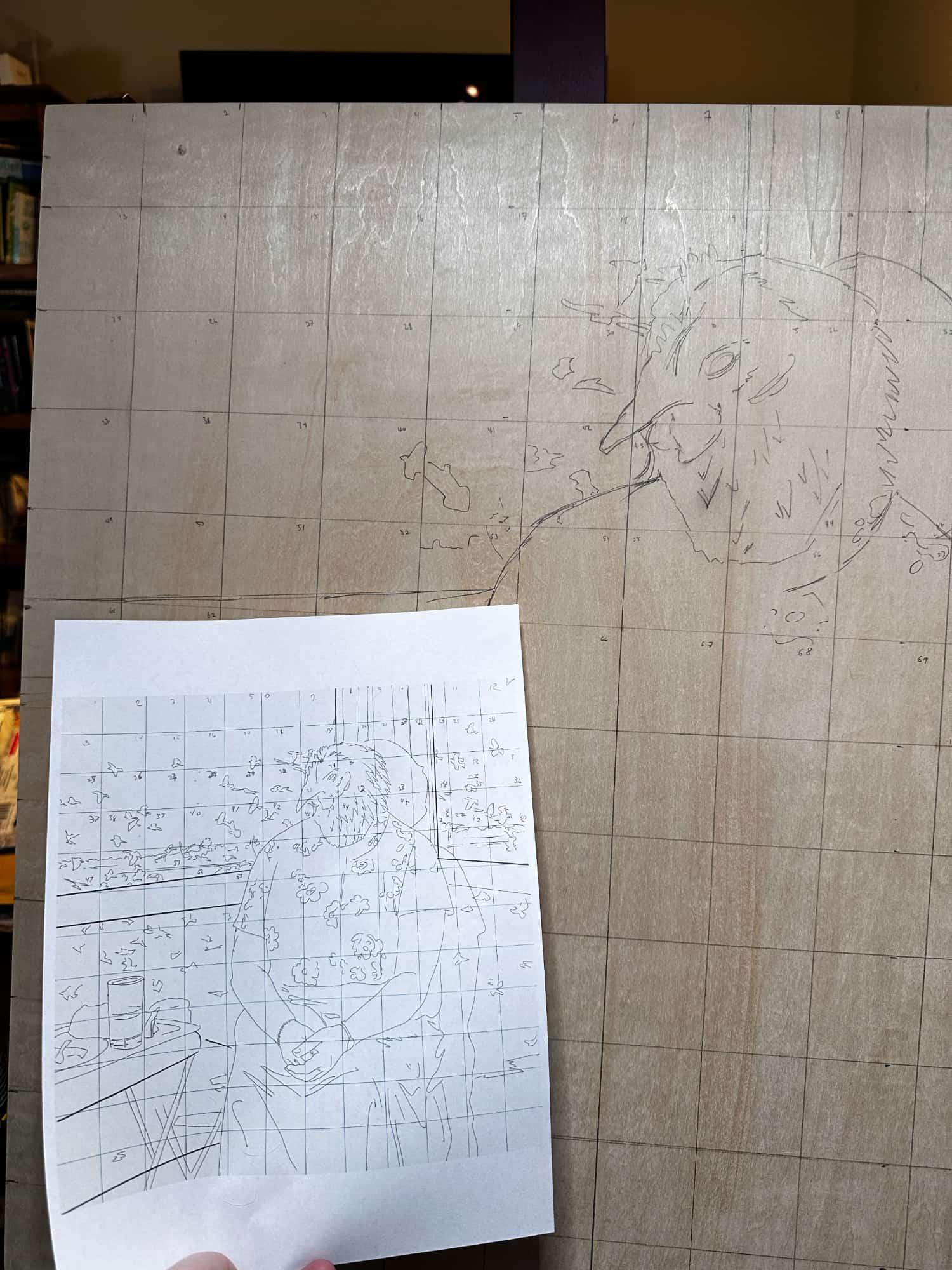 Another photo showing the reference image and the progress onto the wood.